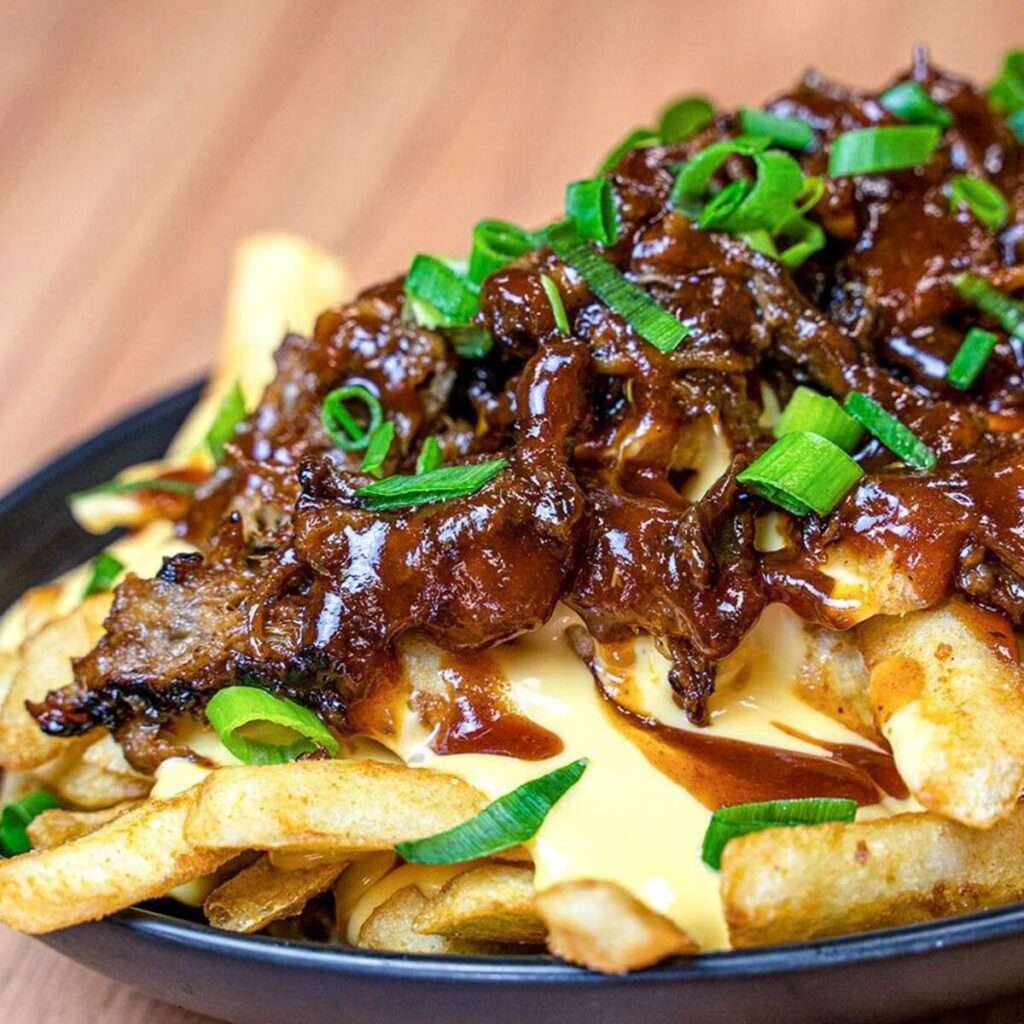 Vrisket loaded fries with cheese sauce and spring onion